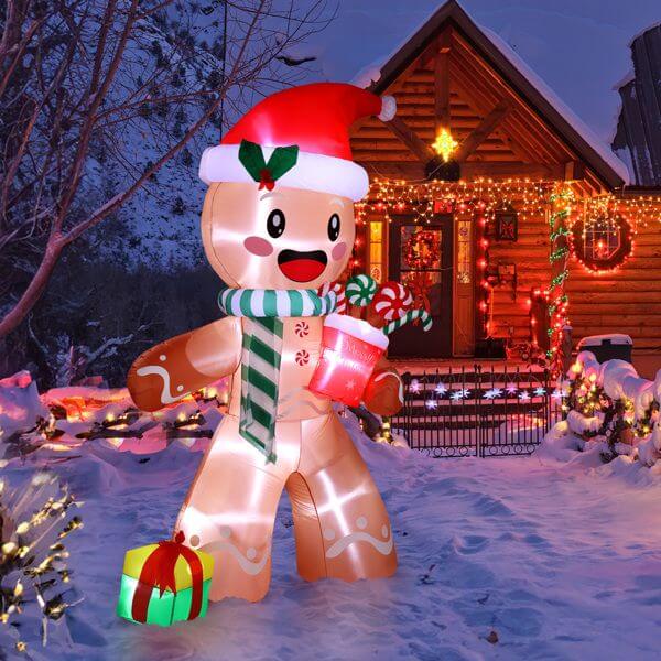 Alt Tag: Christmas Inflatable Decoration - 7.9ft gingerbread man with LED lights joyful holiday scene in snowy yard