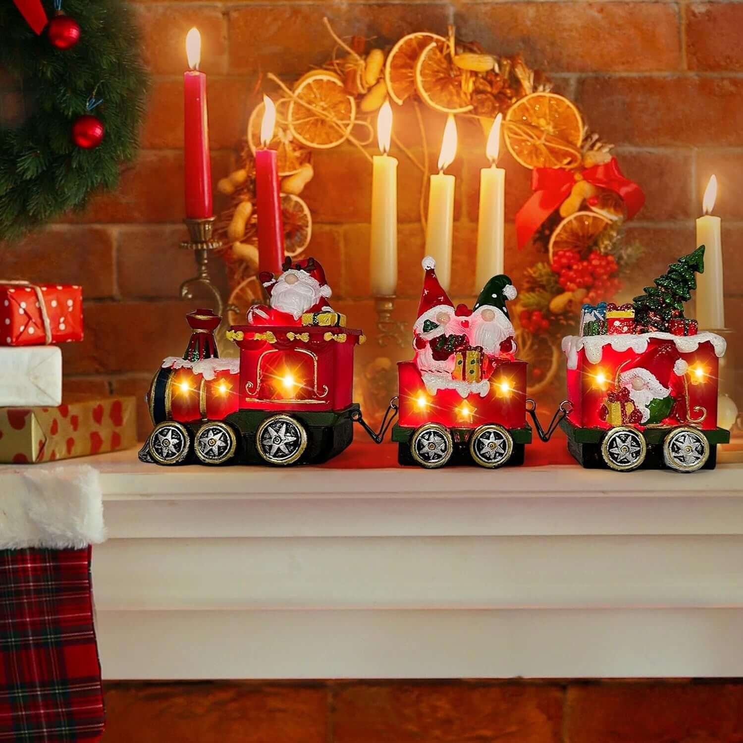 Christmas Gnome Decorations Centerpieces featuring a light-up train set with gnome figurines on a festive mantle.