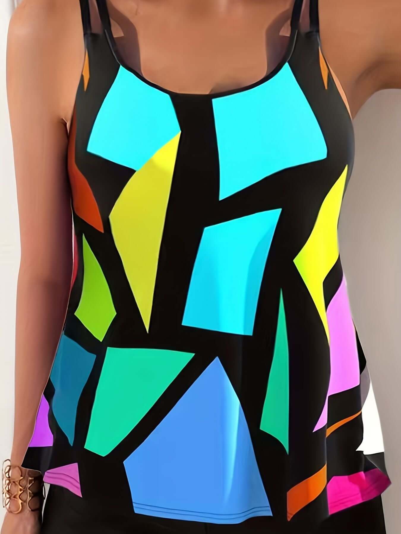 Vibrant geometric pattern tankini, round neck, boxer short swimsuit. Shop women's swimwear at The Tabby Spot.