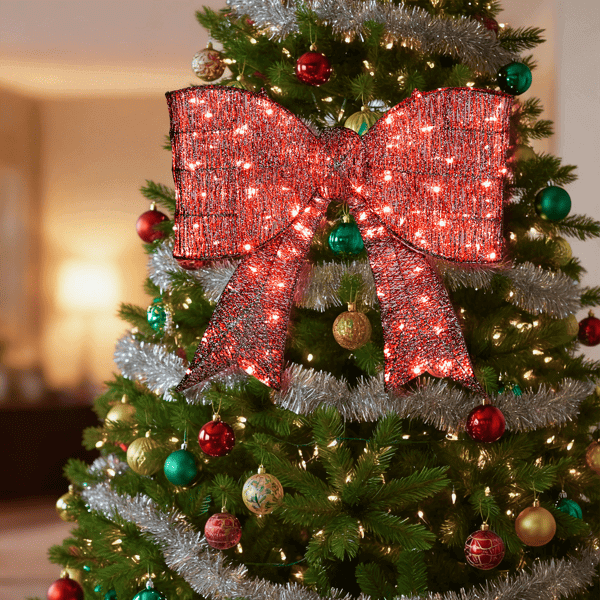 Pre Lit Outdoor Giant Bowknot Christmas Decoration with 124 LED lights on a Christmas tree, festive red ribbon accent for holidays.