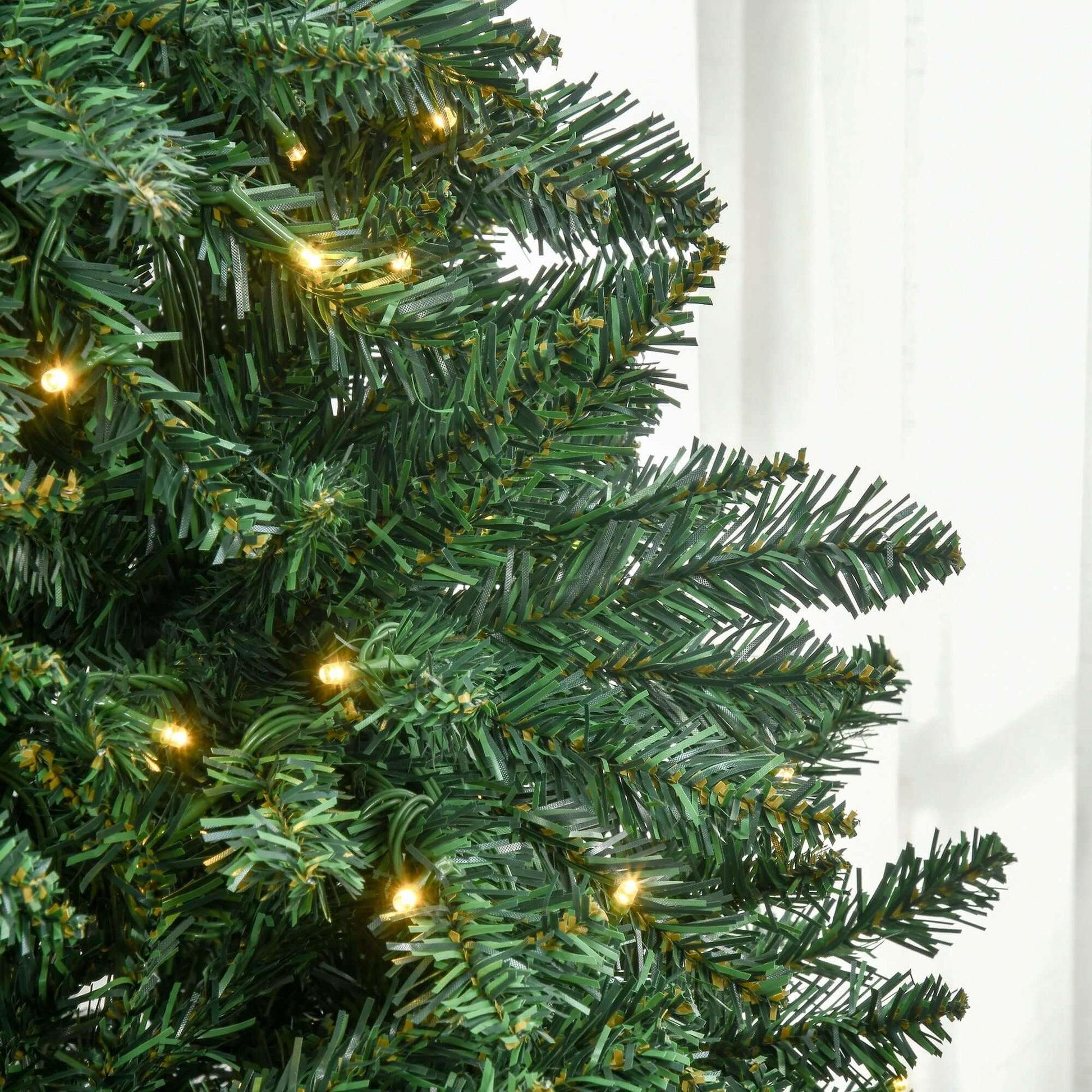 Close-up of HOMCOM 7ft Pre Lit Douglas Fir Artificial Christmas Tree with LED lights and branches