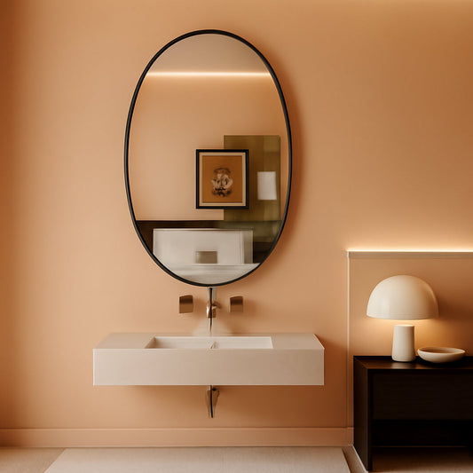 Modern bathroom with Oval Bathroom Mirror 20x28 Black Aluminum Frame Nano Glass above a minimalist sink, warm lighting and elegant decor.