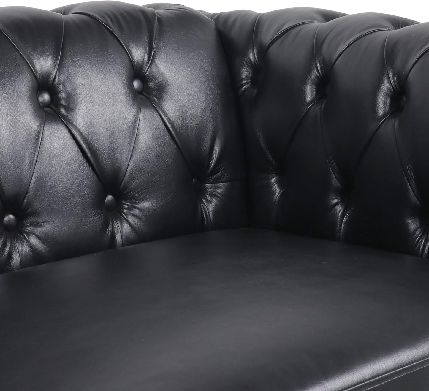 Close-up of Modern Black Faux Leather Tufted Sofa and Chair Set corner detailing with tufted backrest