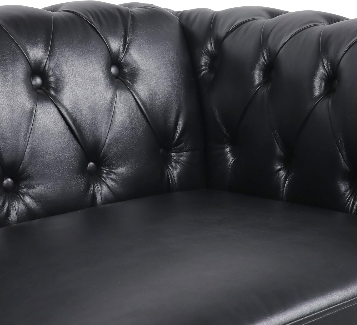 Close-up of Modern Black Faux Leather Tufted Sofa and Chair Set corner detailing with tufted backrest