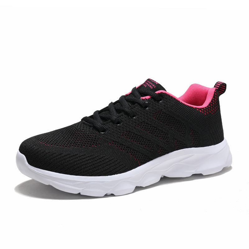 Women’s Mesh Running & Travel Sneakers in black with pink accents, breathable mesh uppers, and cushioned soles for comfort and style.