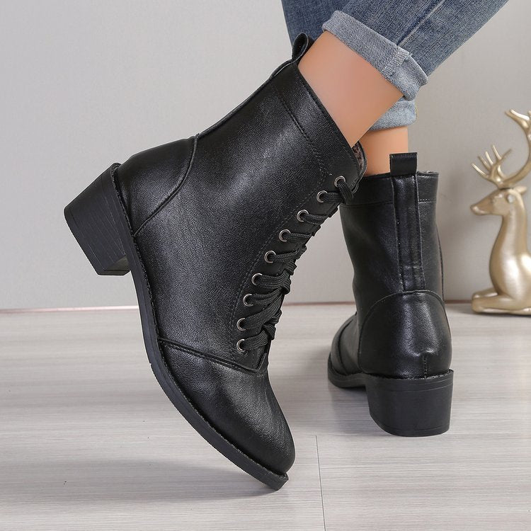 British Style High-Top Zipper Leather Boots — Women’s Trend Fashion Boots in black leather on a wooden floor background.
