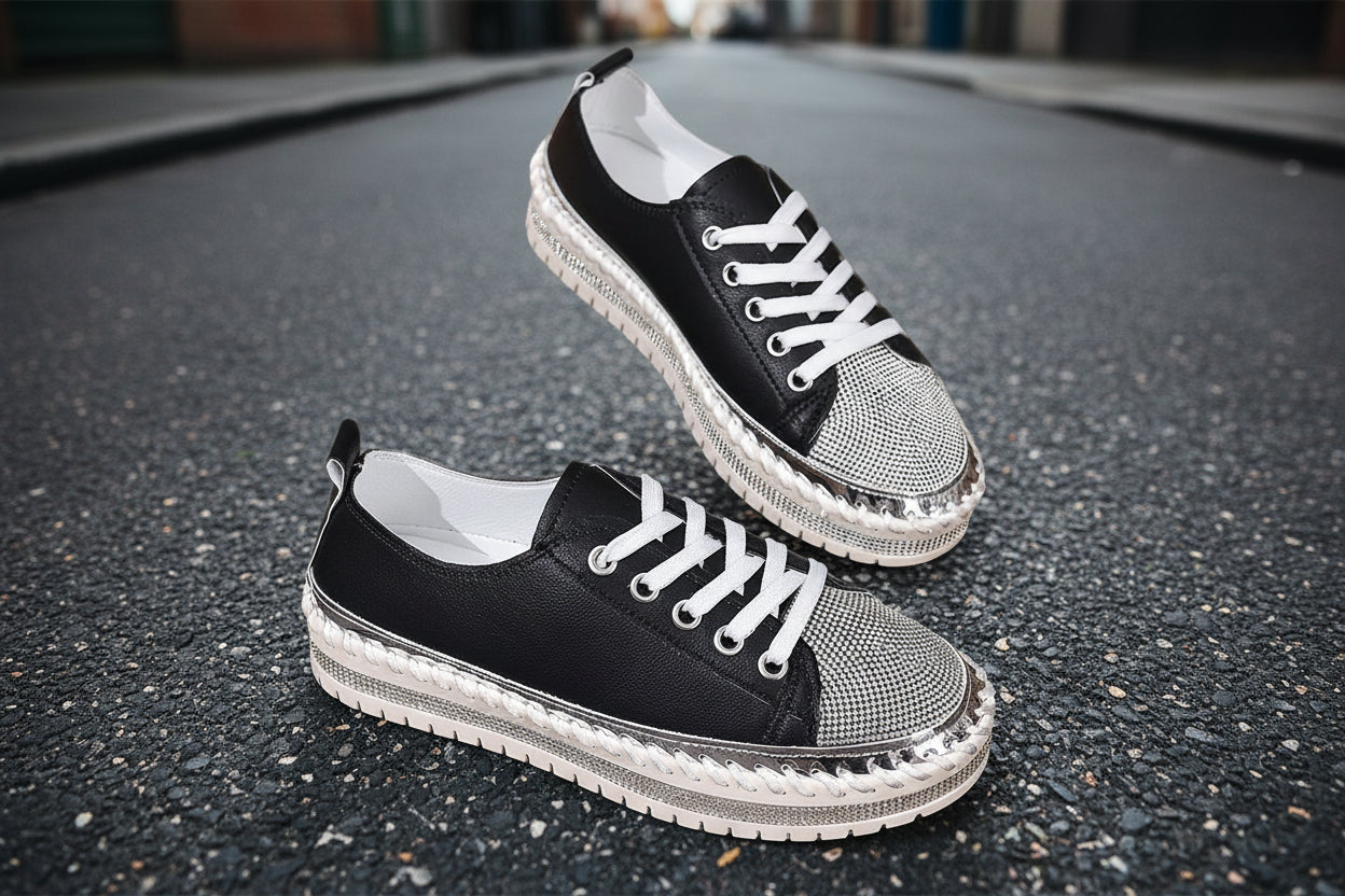 Black and silver chunky sole casual sneakers on pavement