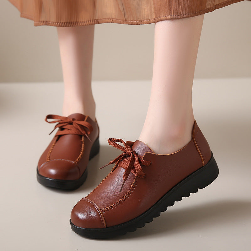 Brown leather flat shoes with laces, soft sole and anti-slip design, perfect for everyday wear and comfort.