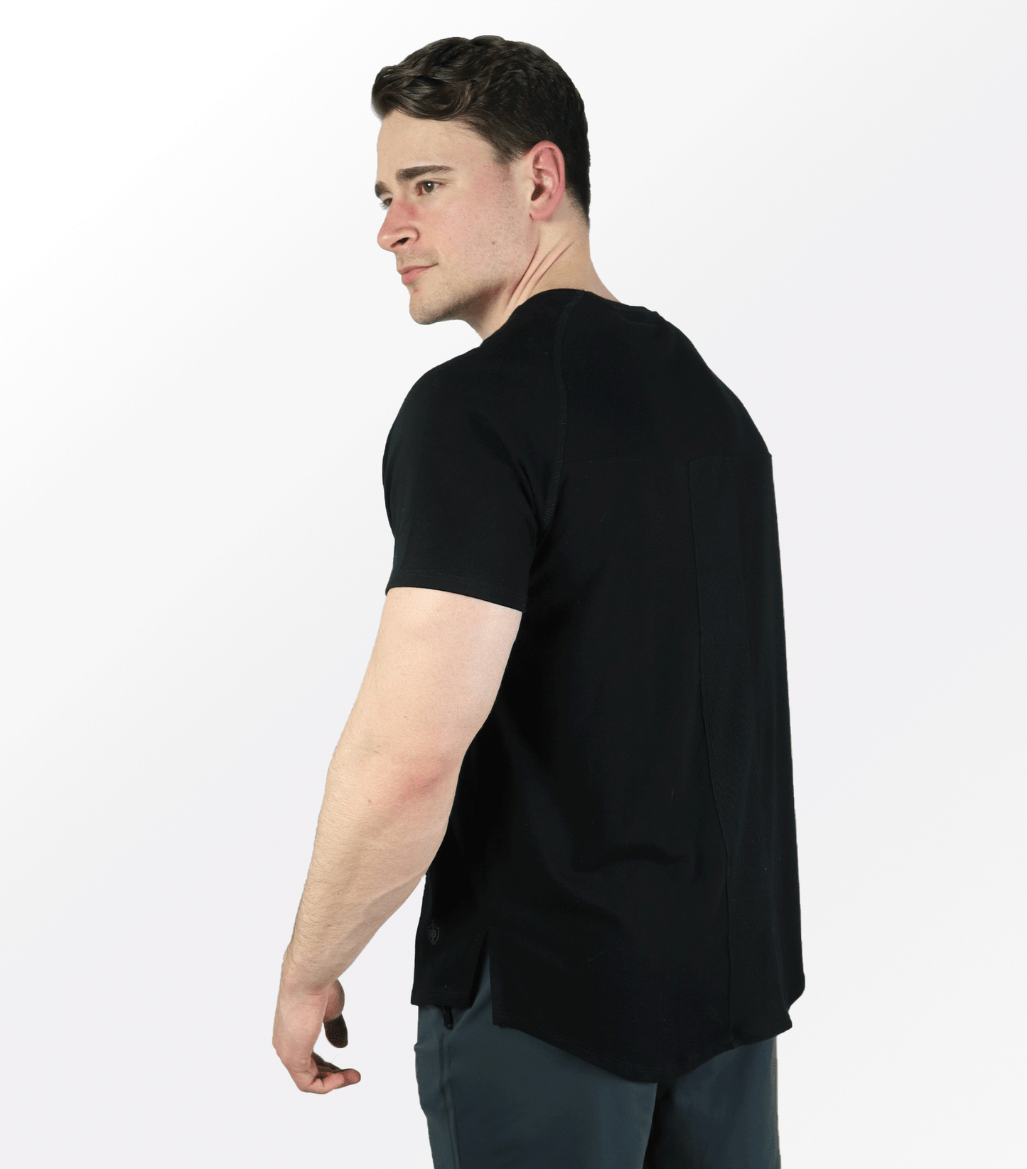 Model wearing Eucalyptus Mesh Tee Black side view moisture-wicking performance te