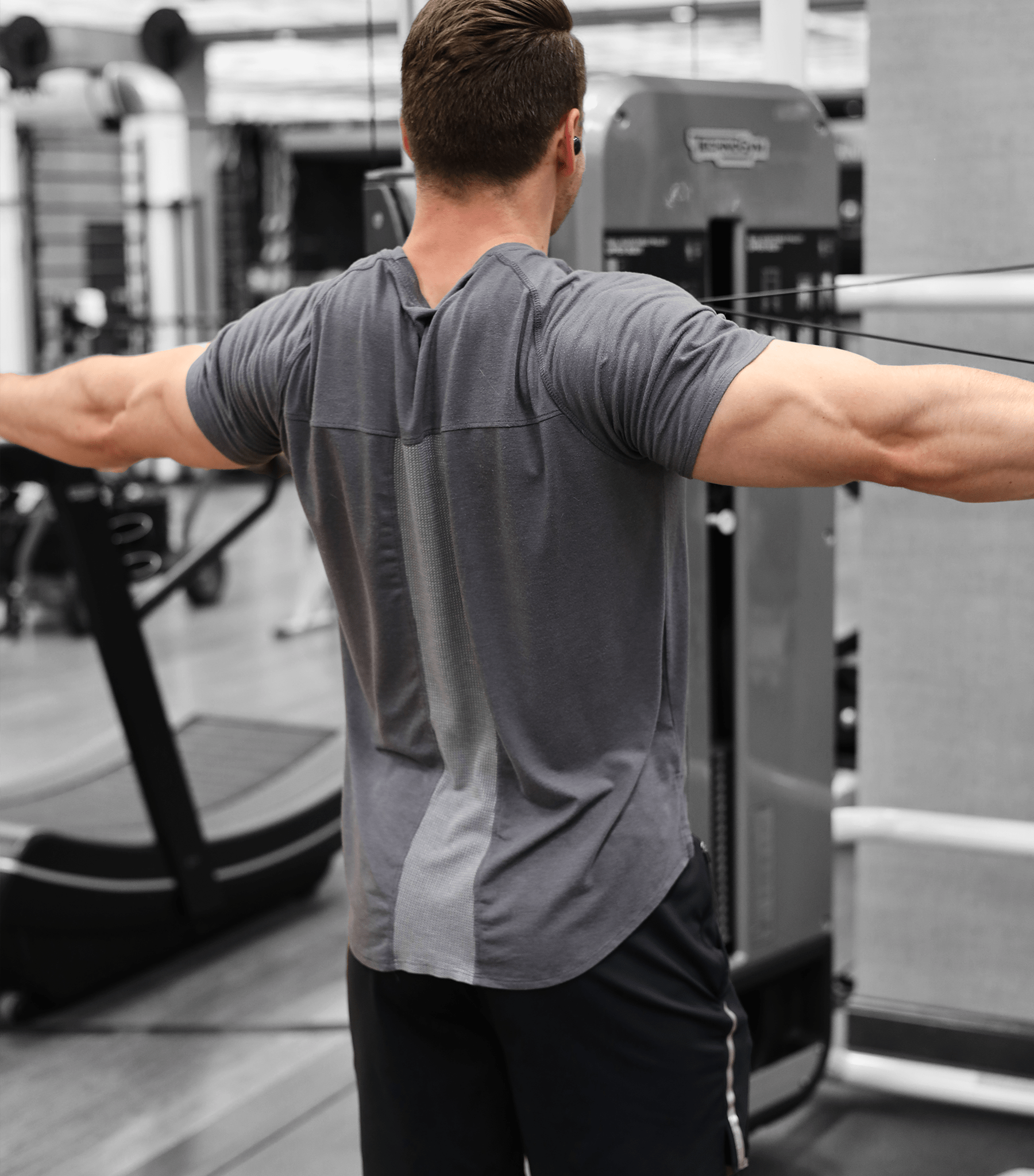  Athlete side view wearing Eucalyptus Mesh Tee in gym moisture-wicking performance tee