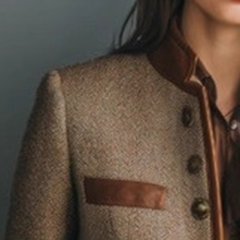 Close-up of Women's Retro Elegant Jacket with stand collar and button-front, showcasing vintage-inspired tailoring and color-block paneling.