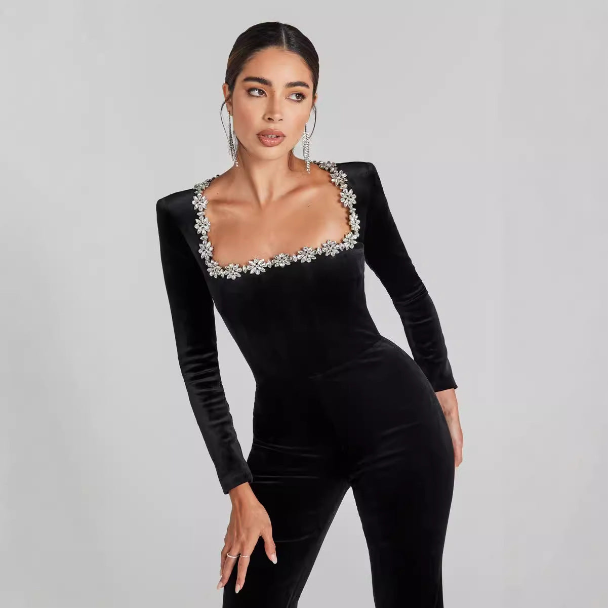 Women’s Diamond-Encrusted Square-Collar Flared Jumpsuit with dazzling accents and flared legs for elegance and glamour.