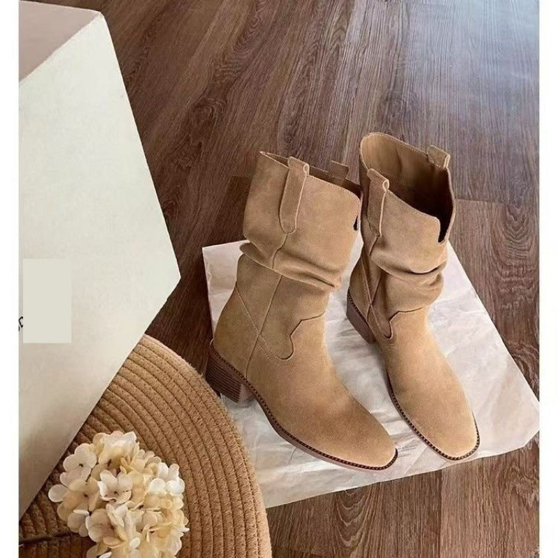 Autumn Western Pleated Short Cowhide Leather Boots for Women on wooden floor