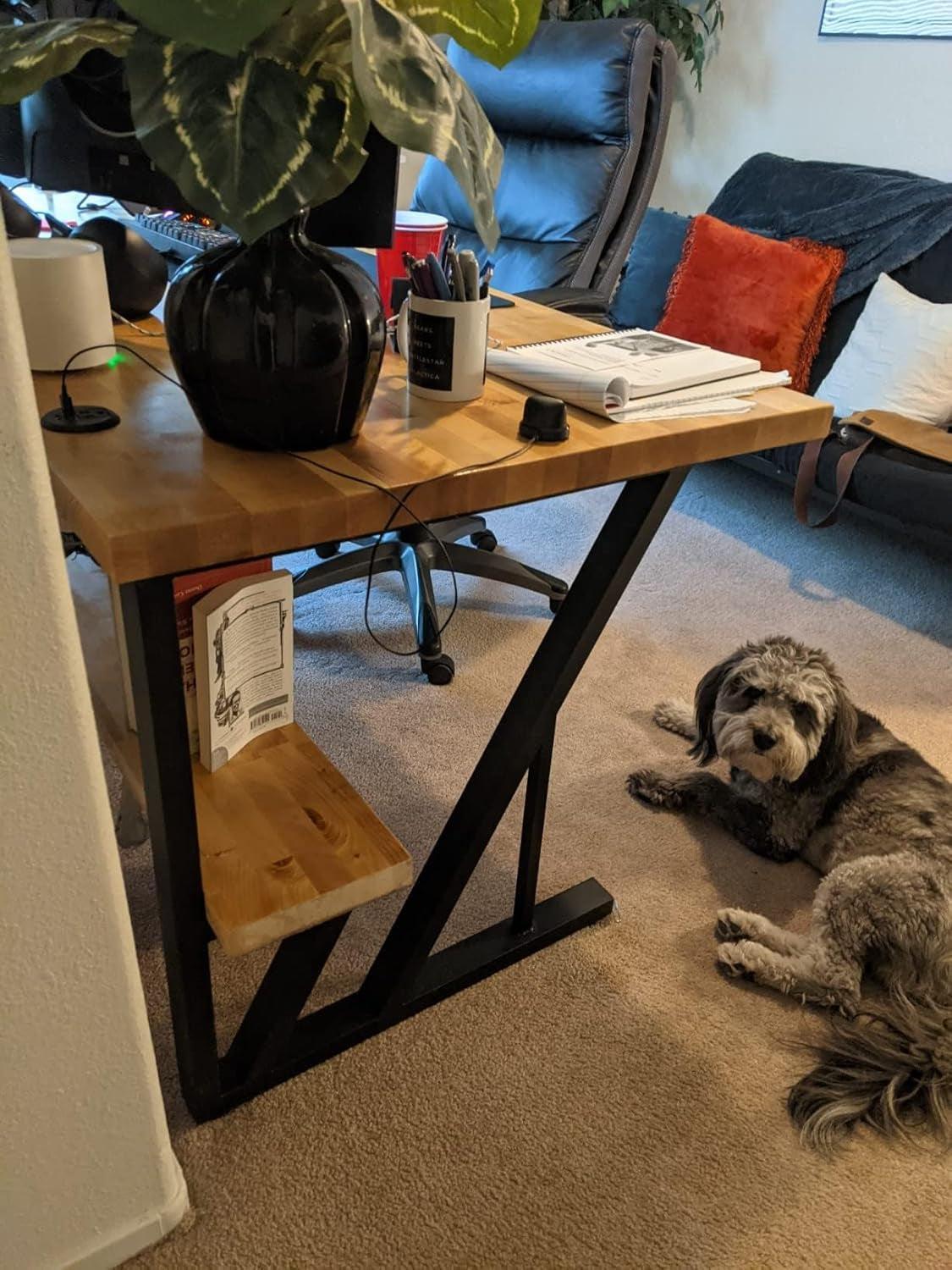 Desk featuring Black Iron Table Legs 28 Inches Industrial Strength with a wooden top, home office setup with a dog on the floor.