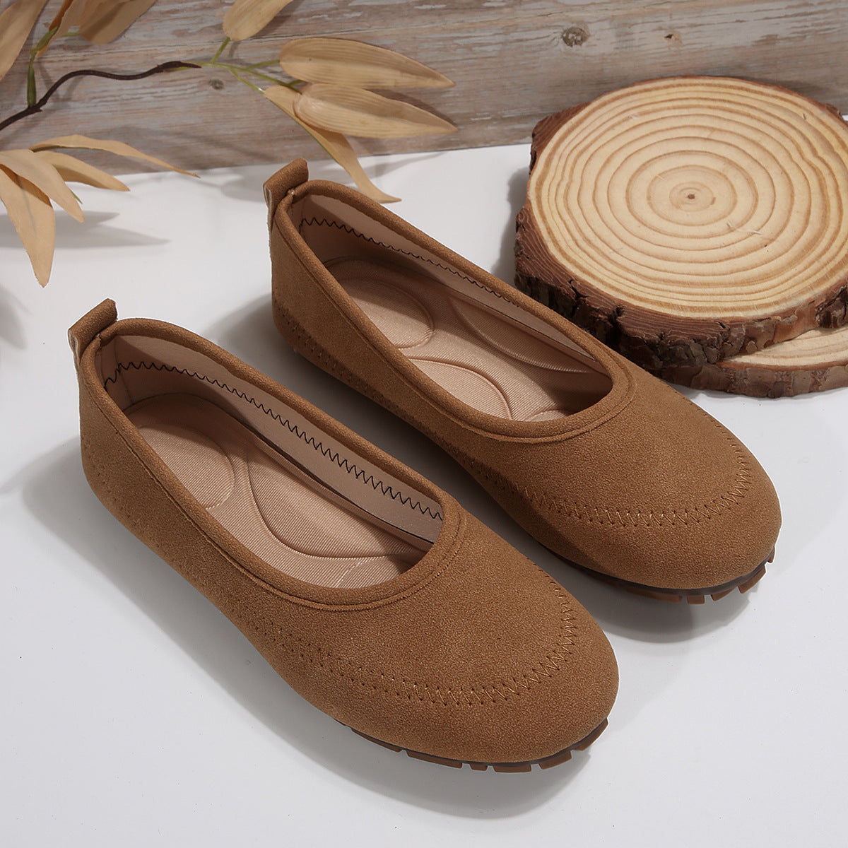 Women’s Low-Cut Round Toe Loafers – Slip-On Flat Casual Shoes in brown, displayed on a rustic wooden background.