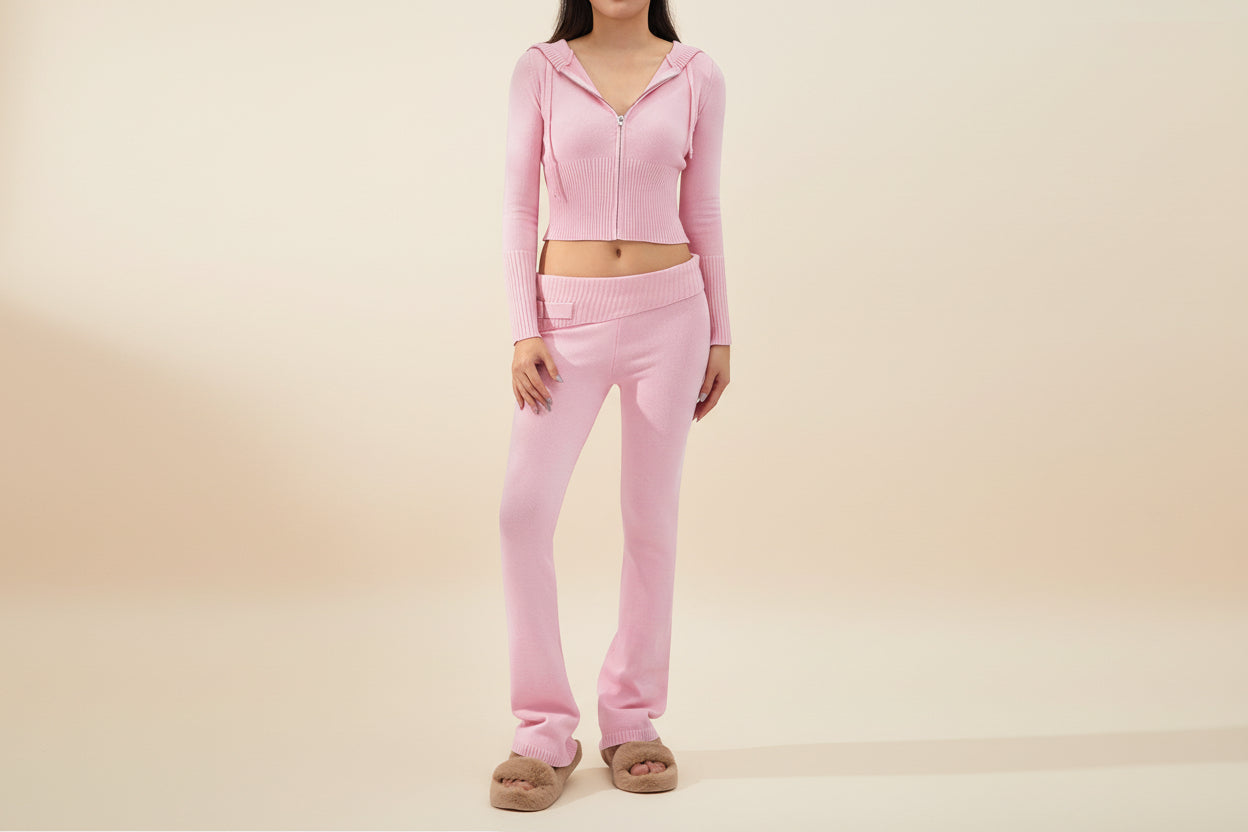 Woman wearing Women’s Knitted Hooded Two-Piece Set – Cardigan & High-Waisted Pants Suit in pink.