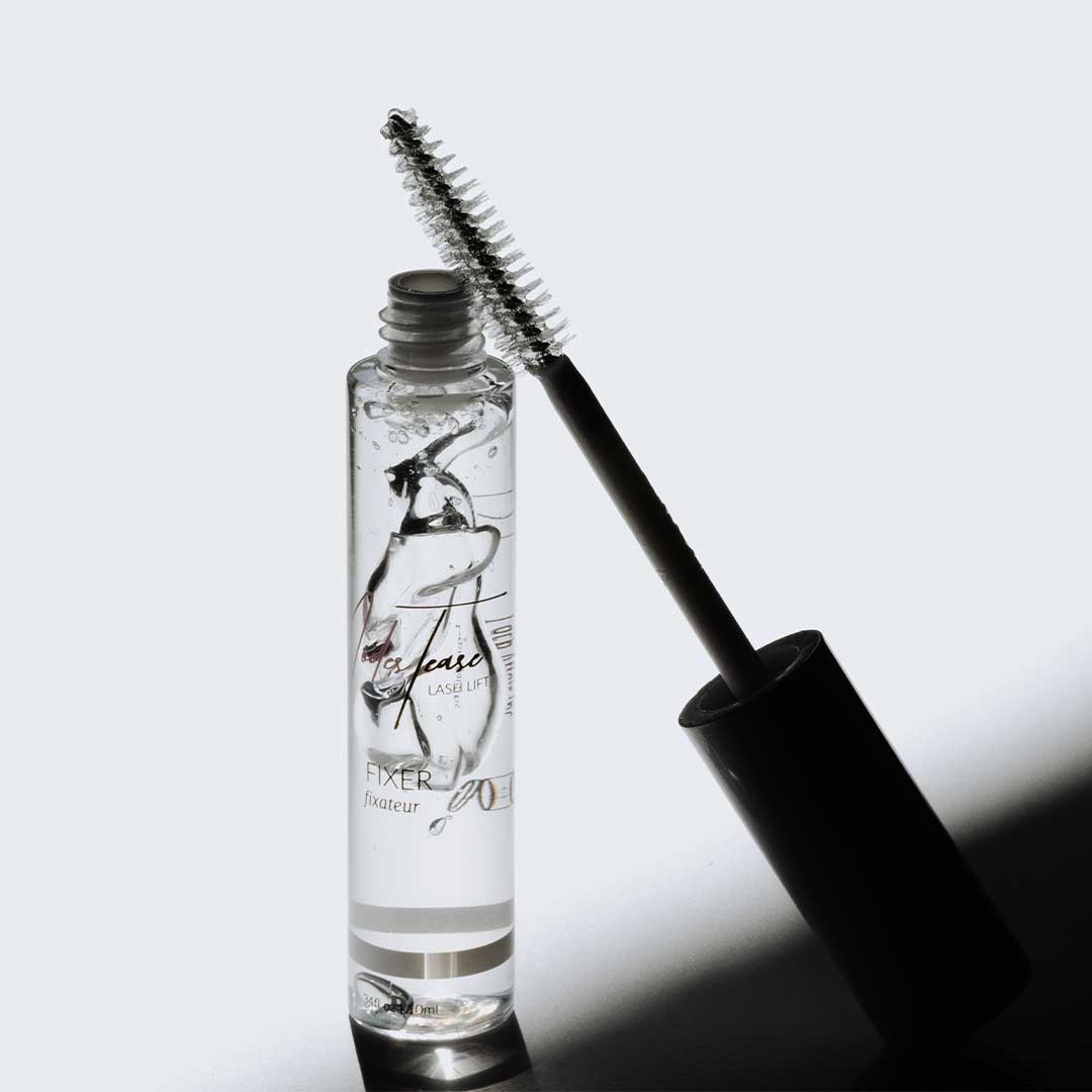 ModesTease | Lash Fixer clear gel for lifting lashes and brows, shown with a brush for easy application and lasting results.