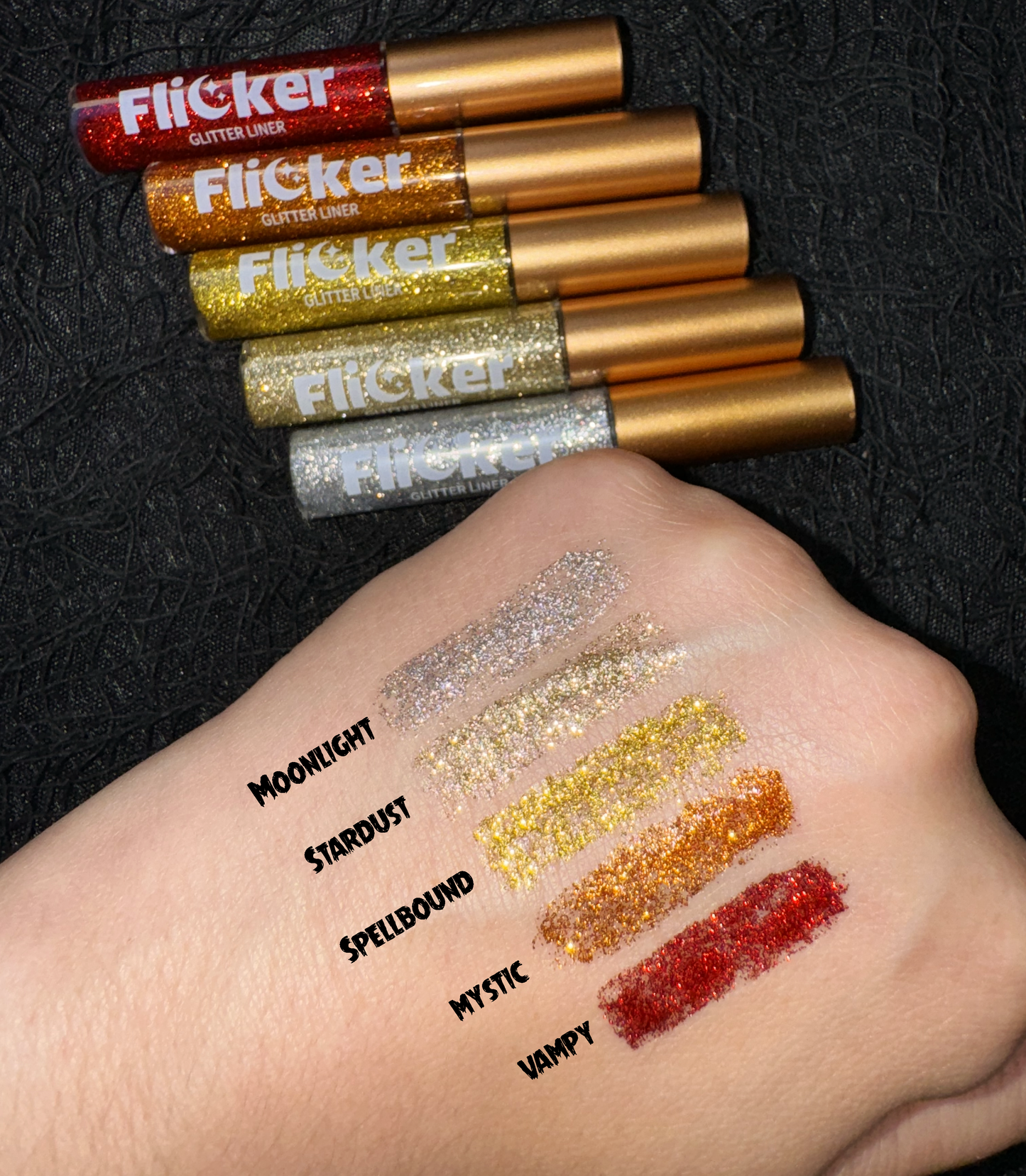 Hand swatched with five Flicker Glitter Eyeliner shades, including Vampy - Flicker Glitter Eyeliner in sparkly red.