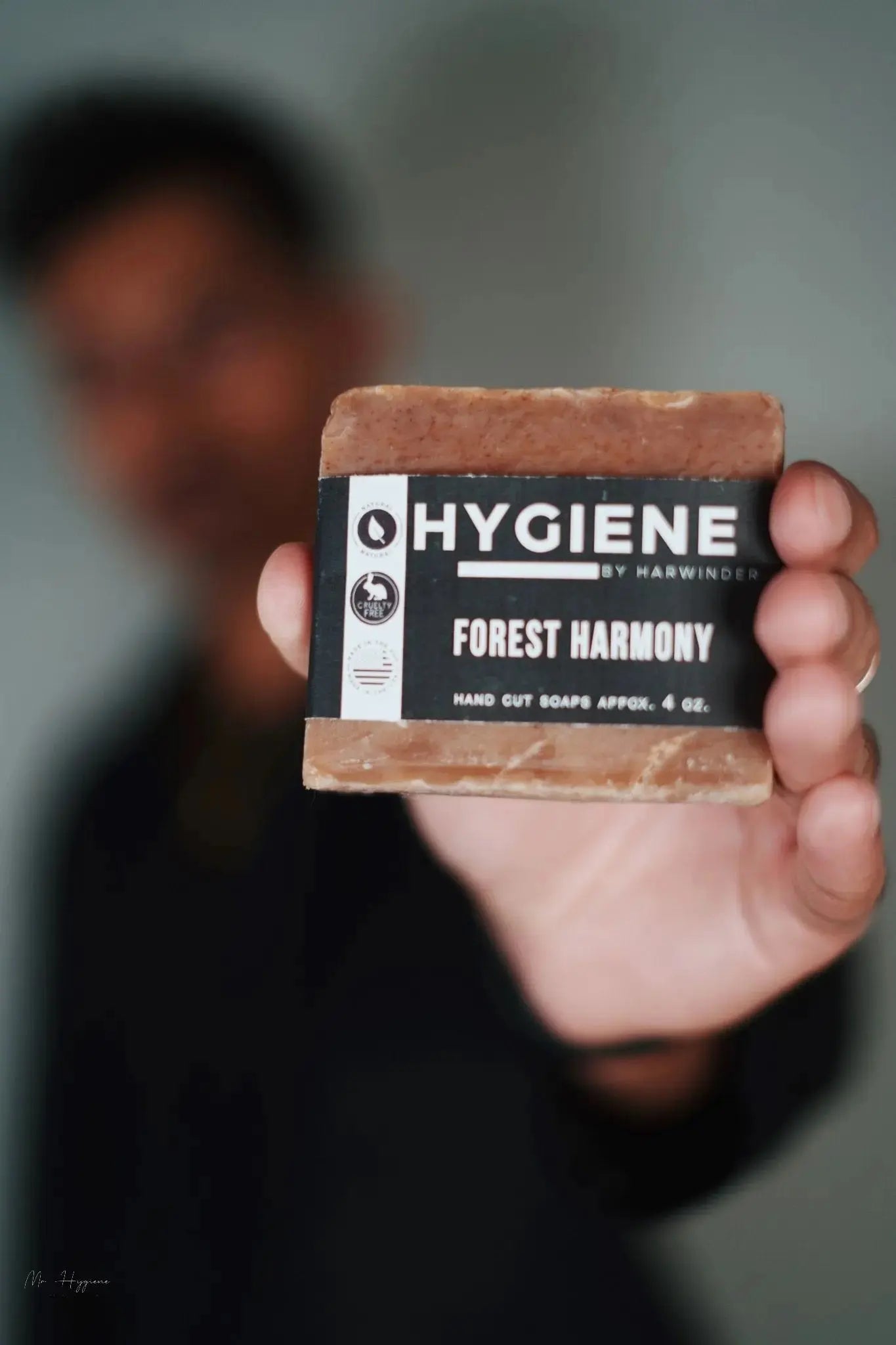 Person holding Forest Harmony Bar Soap – Fresh Woods, Deep Clean, highlighting its natural and invigorating properties.