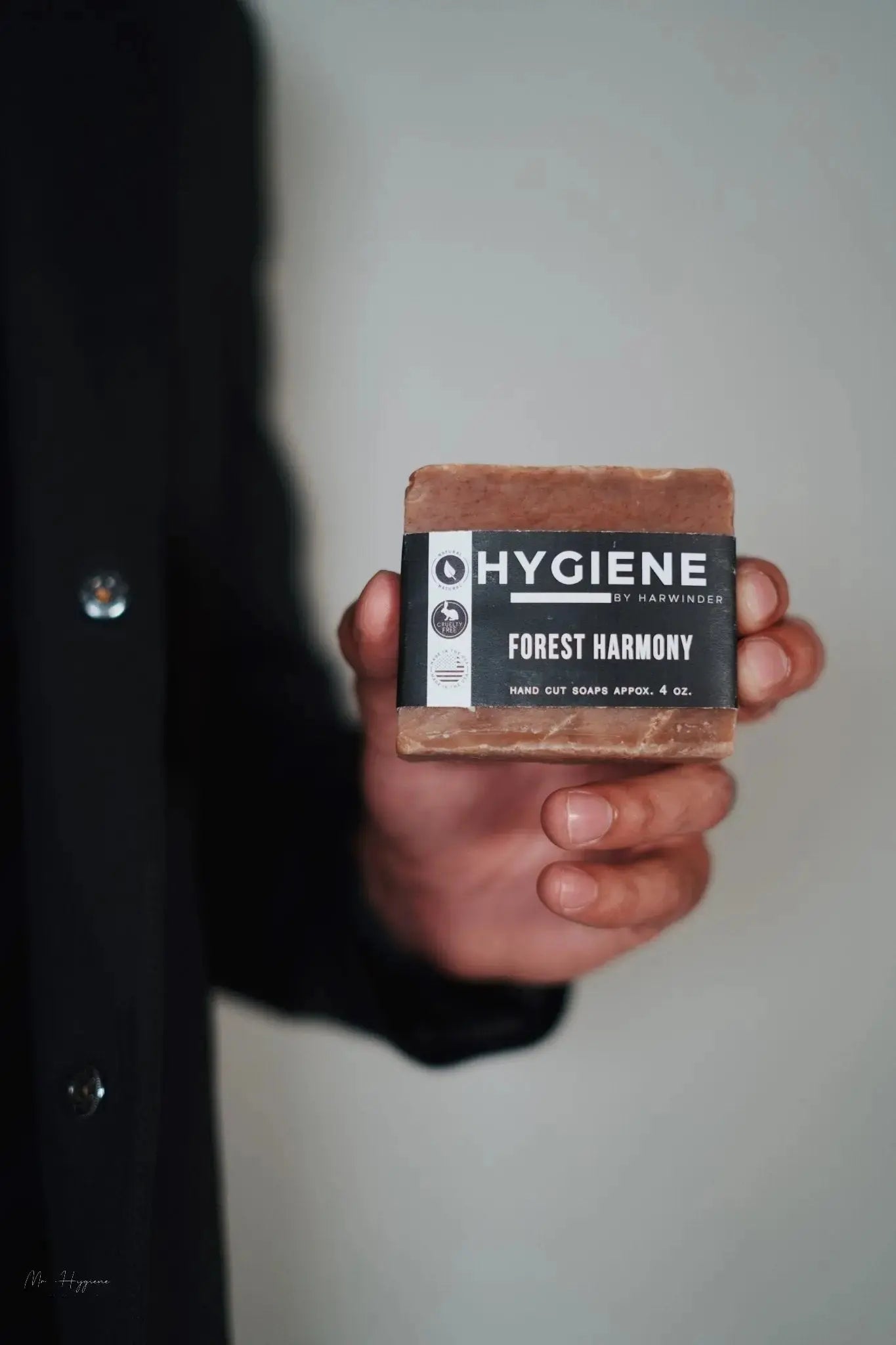 Forest Harmony Bar Soap – Fresh Woods, Deep Clean held by a person, highlighting its eco-friendly and invigorating formula.
