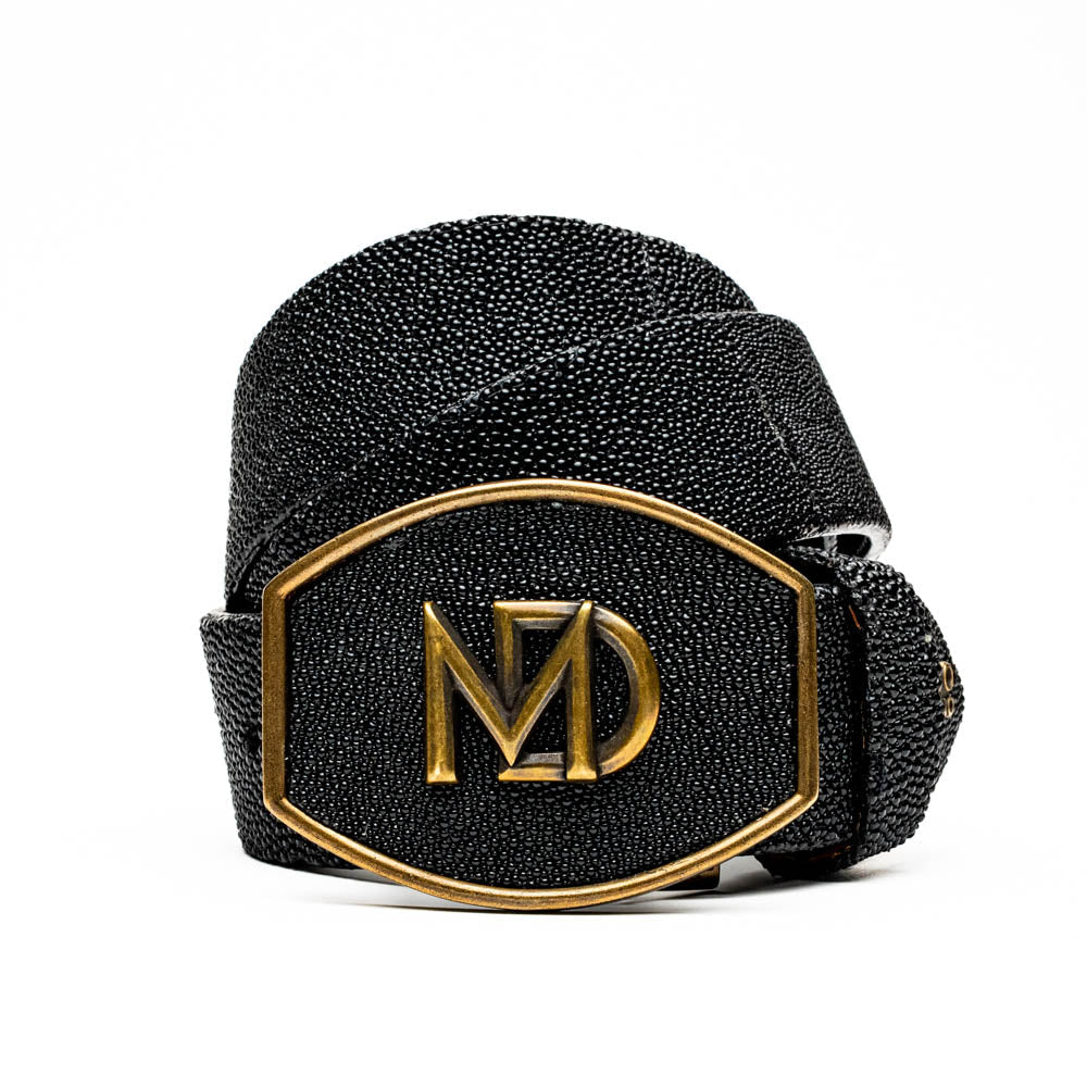 Georgia Belt Black with stingray skin texture and gold buckle, showcasing luxury craftsmanship and exotic design.