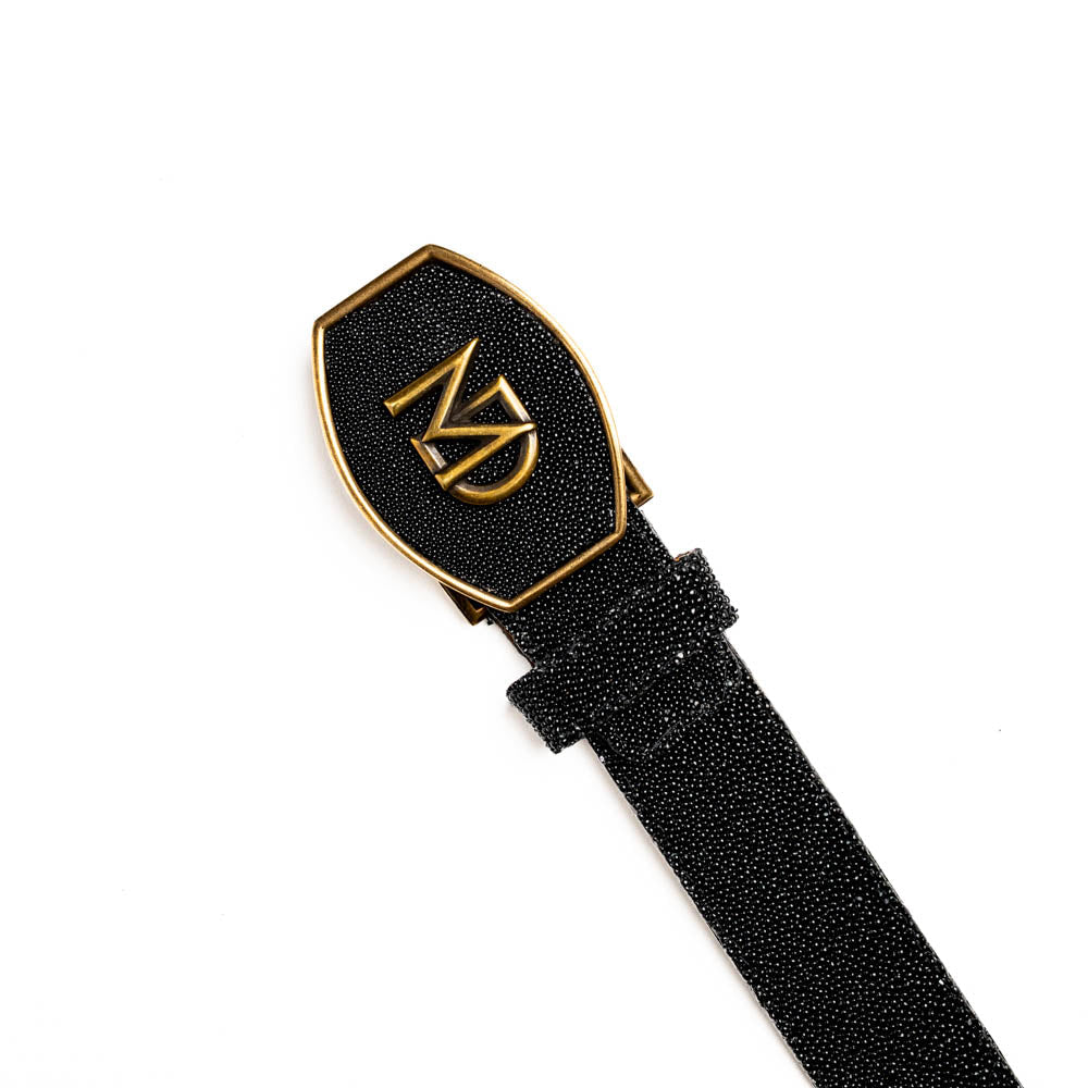 Georgia Belt Black with stingray skin featuring a gold buckle and diamond eye detail, luxury leather accessory.