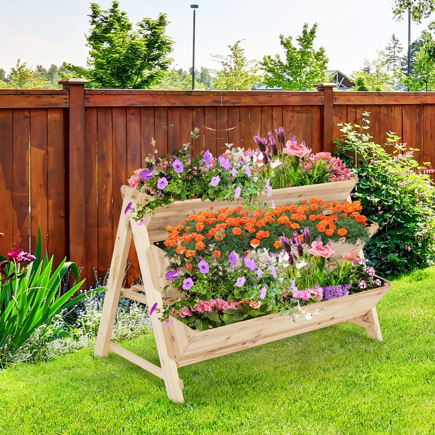 3 Tier Wooden Vertical Raised Garden Bed with Storage Shelf filled with vibrant flowers, showcasing efficient garden space utilization.