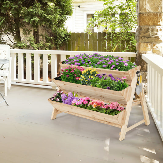 3 Tier Wooden Vertical Raised Garden Bed with Storage Shelf filled with colorful flowers on a patio