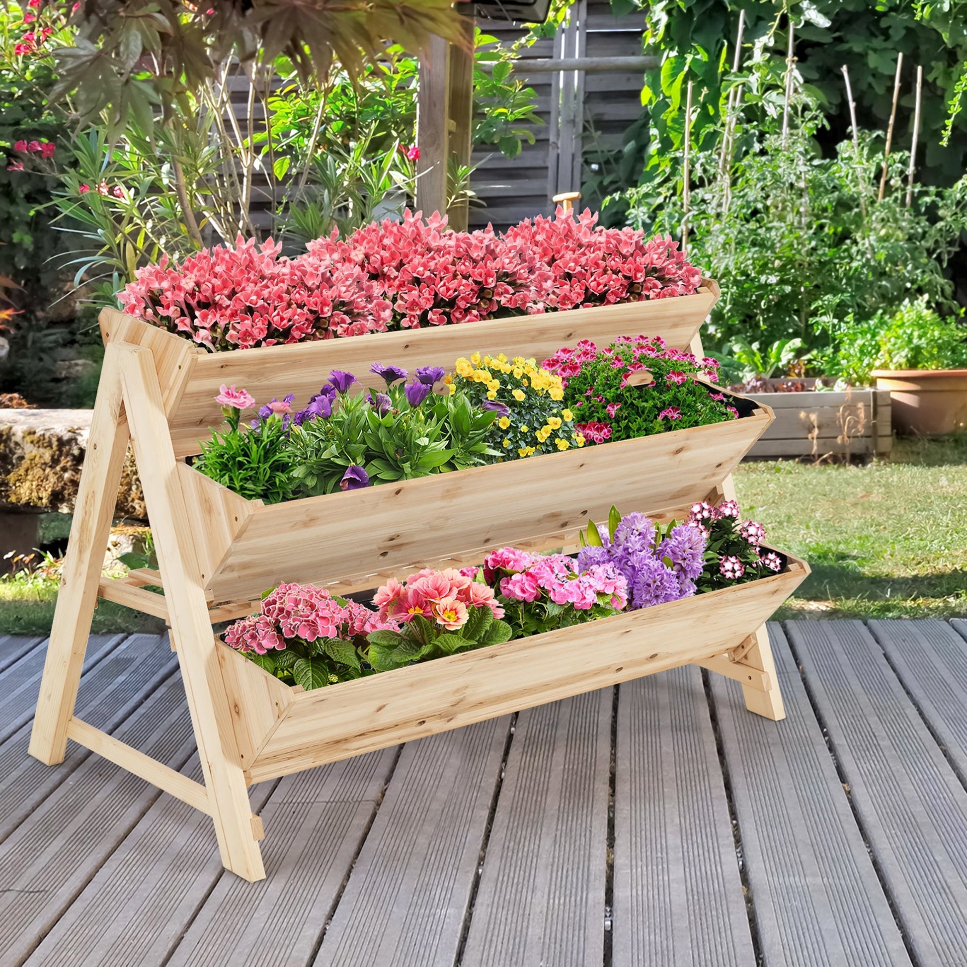 3 Tier Wooden Vertical Raised Garden Bed with Storage Shelf displaying vibrant flowers in a backyard setting