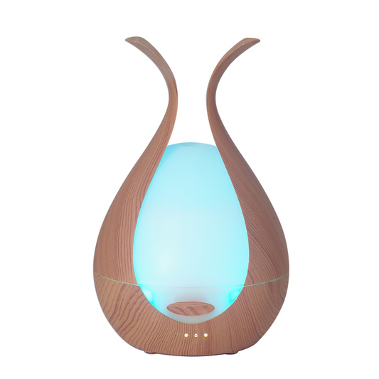Timeless Diffuser with blue LED light, featuring elegant design for premium aromatherapy with 200mL tank and ultrasonic atomization.