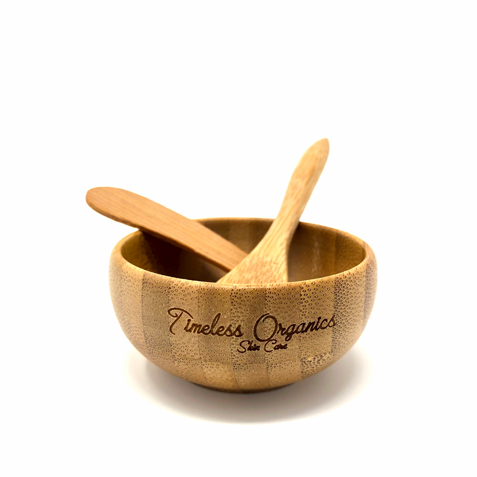 Bamboo Utensil Set in a bowl, eco-friendly spa kit from Timeless Organics for easy mask mixing and application, made from sustainable bamboo.