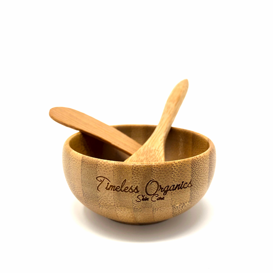 Bamboo Utensil Set in a bowl, eco-friendly spa kit from Timeless Organics for easy mask mixing and application, made from sustainable bamboo.