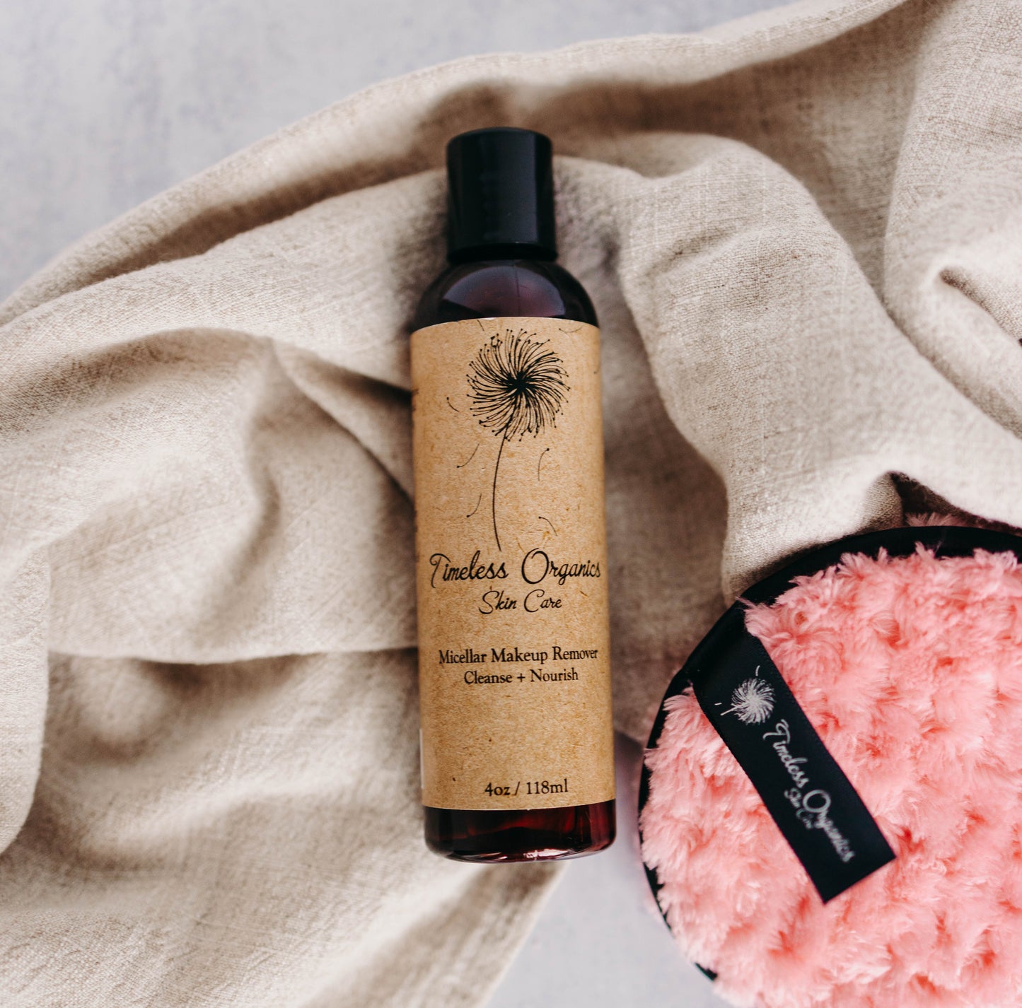 Timeless Organics Micellar Cleansing Water bottle with makeup remover pad and towel