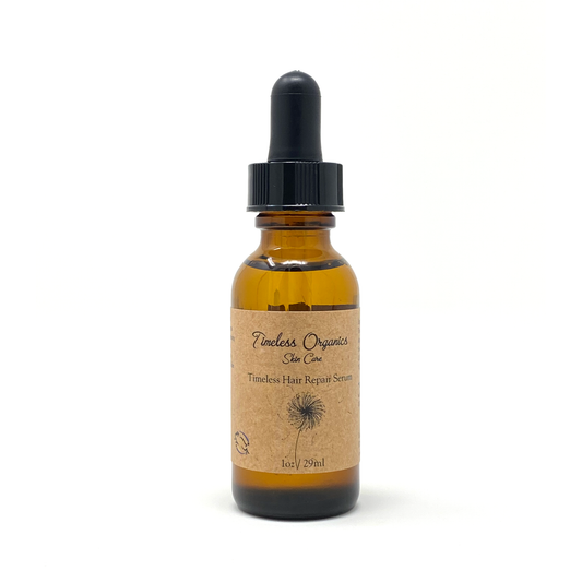 Bottle of Timeless Organics Hair Repair Serum for stronger and shinier hair, featuring organic oils for moisture and growth.