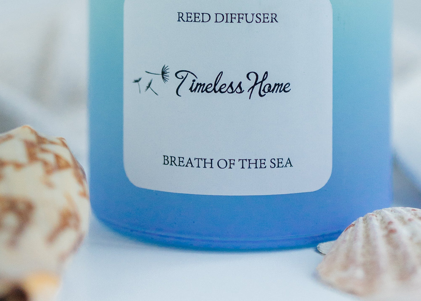 Reed Diffuser - Breathe of The Sea in a frosted glass with ocean-themed design, enhancing home ambiance.