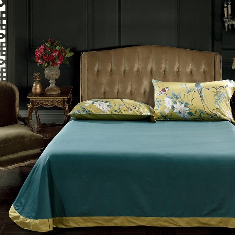 Elegant bedroom with Birds Of Afrodita Duvet Cover Set (Egyptian Cotton) featuring luxurious pillowcases and duvet in vibrant colors.