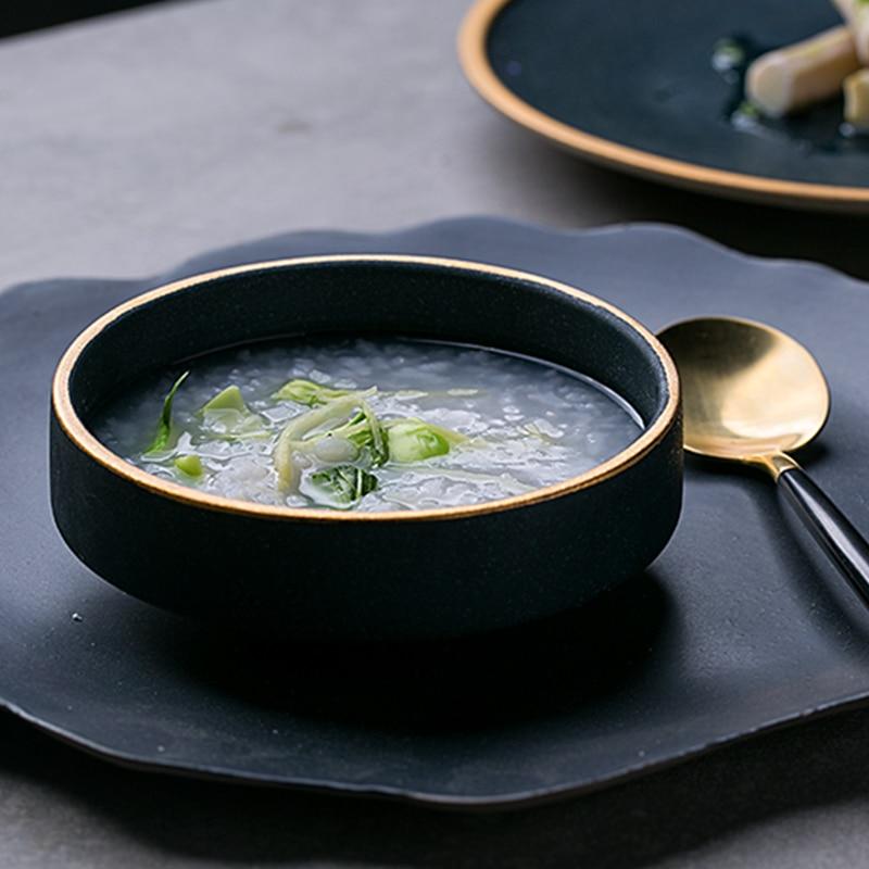 Galileo Tableware handcrafted porcelain bowl with matte green glaze and golden ring, showcasing elegant minimalist dining design.