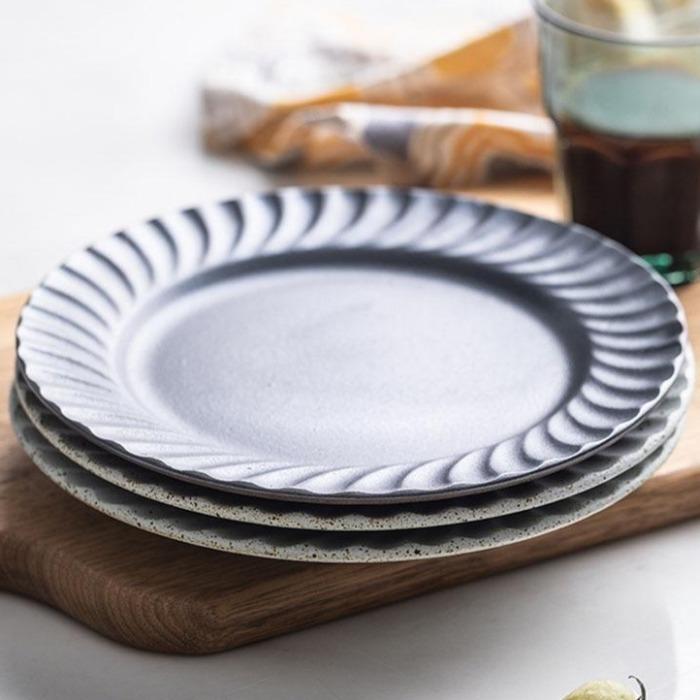 Set of hand-made Ceto Nordic Plates with unique ceramic design, perfect for elevated everyday dining.