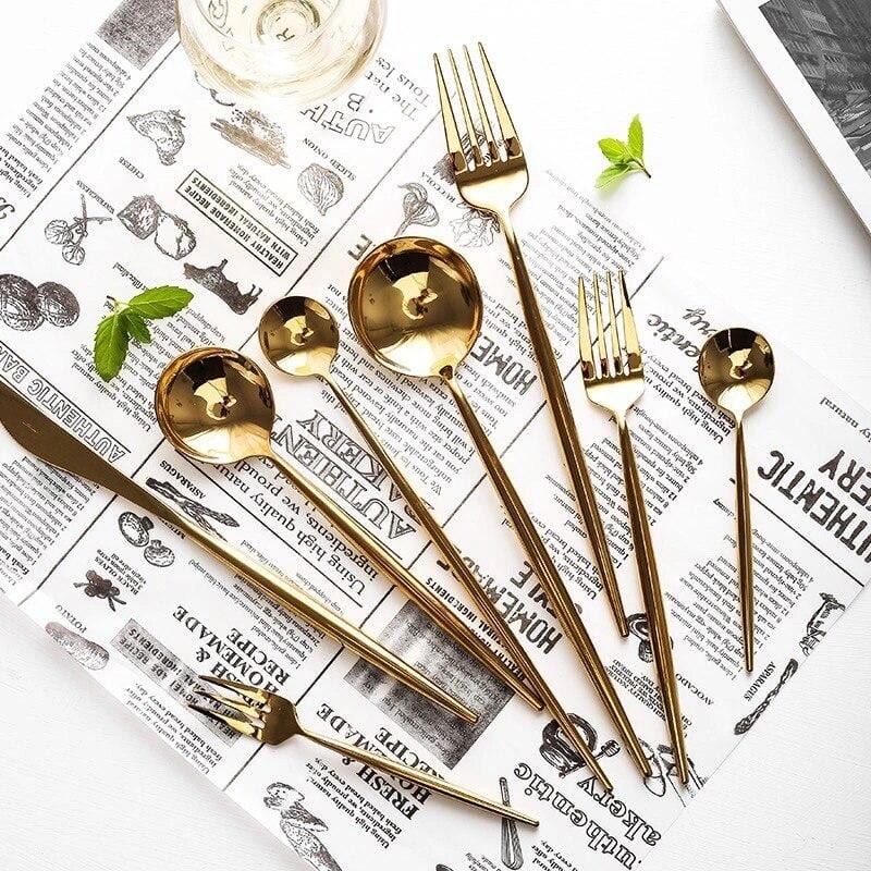 Stella 30-Piece Flatware Set with mirror-polished stainless steel, Korean style design, on a newspaper background.