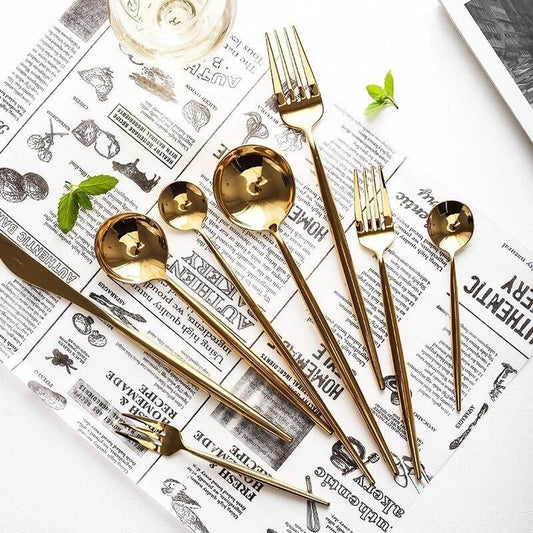 Stella 30-Piece Flatware Set with mirror-polished stainless steel, Korean style design, on a newspaper background.