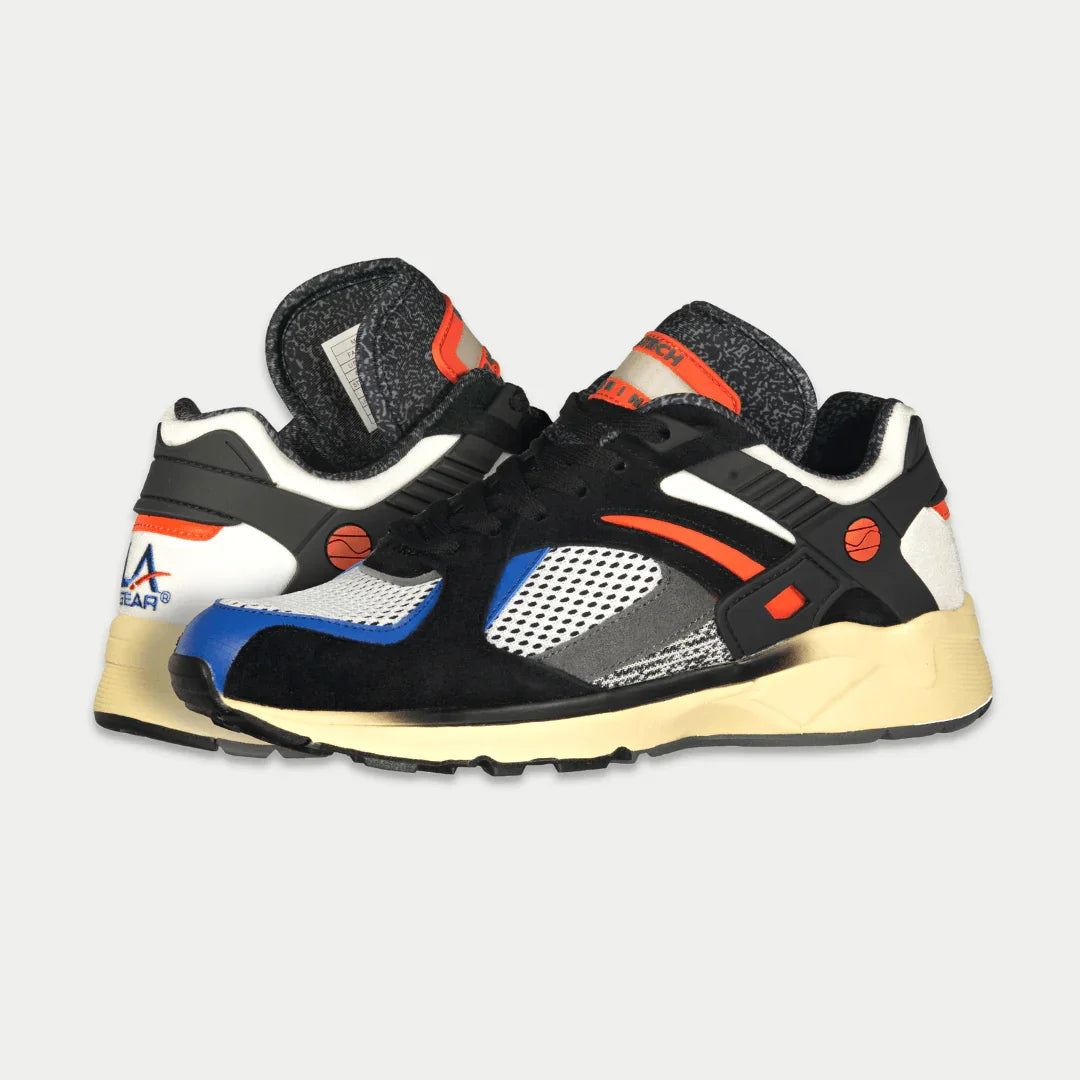 LA Gear Men's Catapult Light-Up Lowtop | Black x Orange sneakers with iconic 90s design and light-up details against white background.