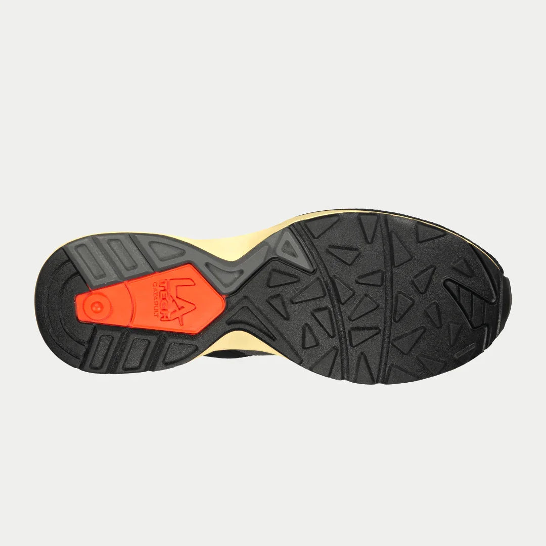 Sole view of LA Gear Men's Catapult Light-Up Lowtop | Black x Orange sneaker, showcasing durable tread design and iconic color accents.