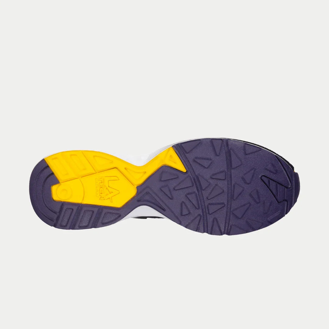Sole view of LA Gear Men's Catapult Light-Up Lowtop in black, purple, and yellow showing unique tread pattern and durability.