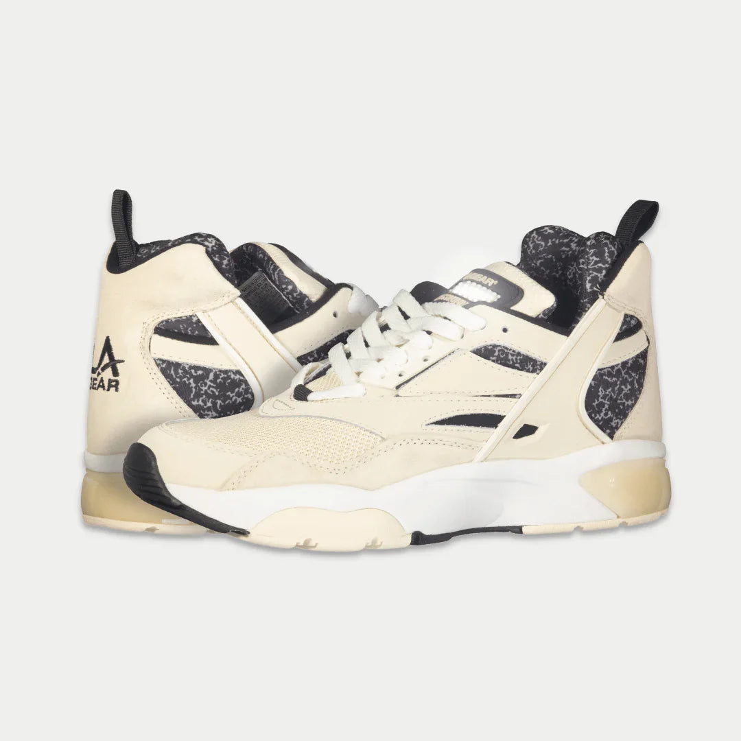 LA Gear Men's Turbo Light-Up Mid | Off-White x Black sneakers showcasing 90s style with light-up detail and bold design.