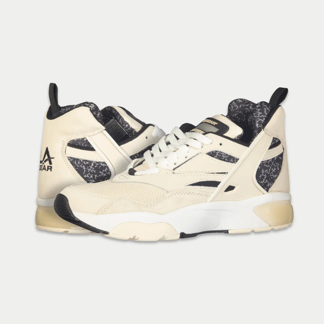 LA Gear Men's Turbo Light-Up Mid | Off-White x Black sneakers with light-up detail, comfortable cushioning, and durable leather and mesh design.