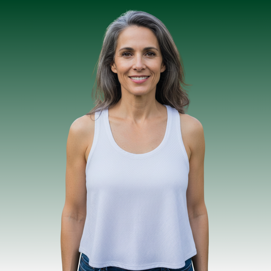 Woman wearing LA Gear Women’s Athletic Mesh Tank | White against a gradient background