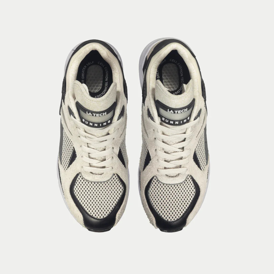 Top view of LA Gear Women's Catapult Light-up Lowtop | White x Black sneakers with mesh design and leather accents.