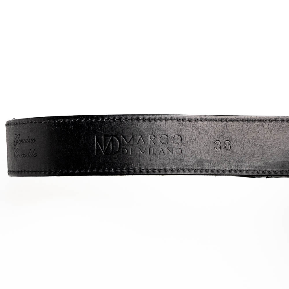 Close-up of black Marco di Milano belt with branding and size imprints, showcasing sleek design and quality craftsmanship.