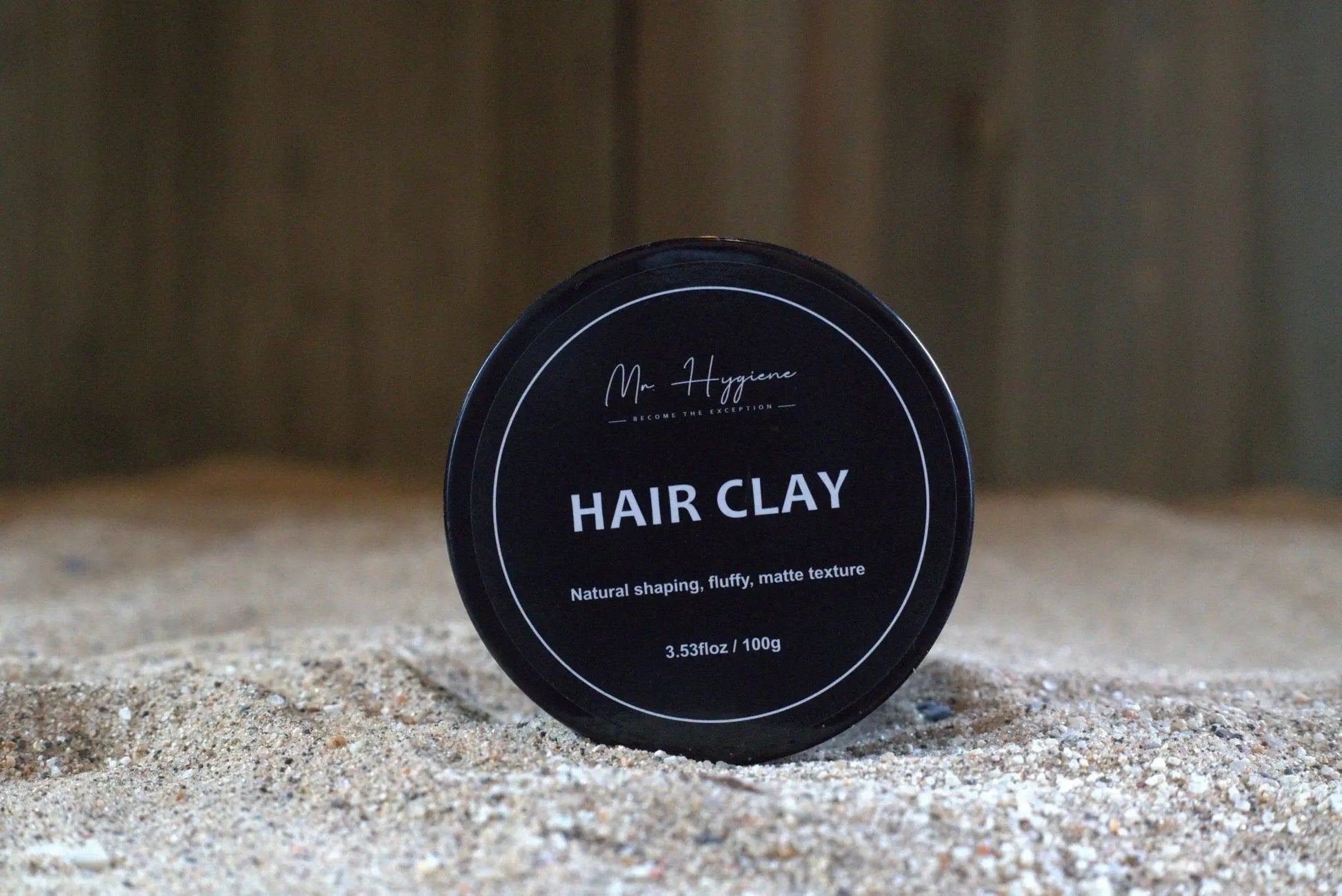 Matte Finish Hair Clay - Strong Hold. Zero Shine. All-Day Control. in a sleek black container with natural shaping description.