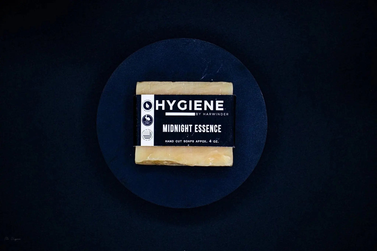 Midnight Essence Bar Soap – Bold Scent, Deep Clean on a dark plate, showcasing eco-friendly design and botanical ingredients.